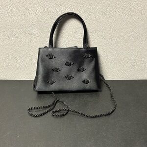 Elegant Black Handbag with Floral Accents